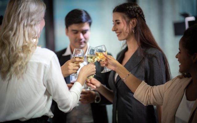 Business partners toast champagne company event celebration success